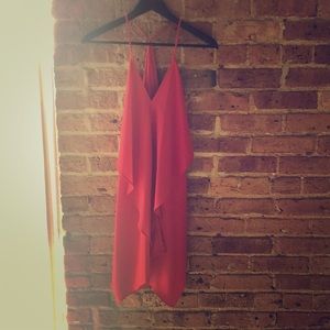 Akira Red Dress- drapes for a flattering look.